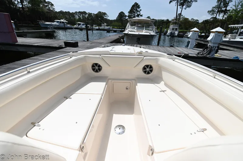  Yacht Photos Pics 2019 Grady-White Freedom 275 boat interior at a marina dock.