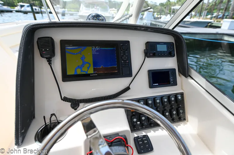  Yacht Photos Pics 2019 Grady-White Freedom 275 boat dashboard with navigation and control systems.