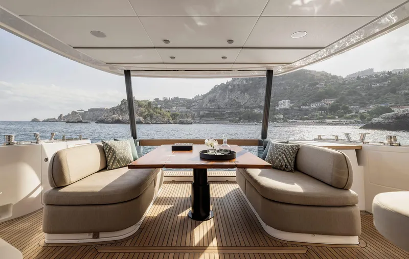  Yacht Photos Pics Luxurious 2024 Azimut Magellano 60 yacht interior with elegant seating and scenic ocean view.