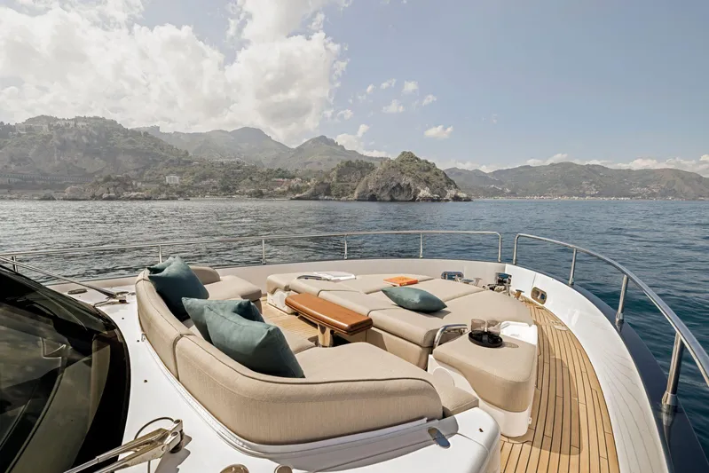  Yacht Photos Pics Luxurious 2024 Azimut Magellano 60 yacht deck with scenic ocean and mountain views.