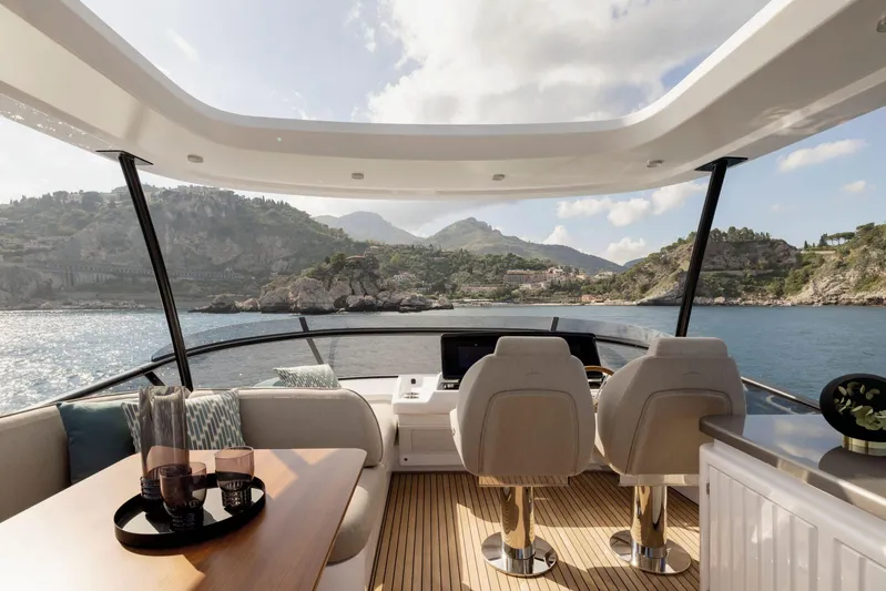  Yacht Photos Pics Luxurious 2024 Azimut Magellano 60 yacht interior with scenic ocean view.