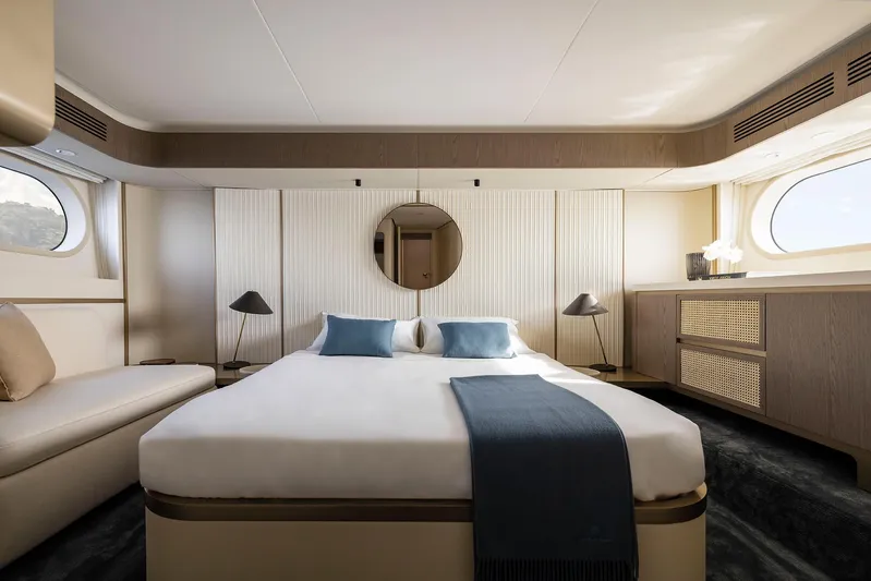  Yacht Photos Pics Luxurious bedroom interior of 2024 Azimut Magellano 60 yacht with modern decor and large windows.