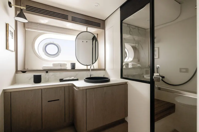  Yacht Photos Pics Luxurious bathroom in 2024 Azimut Magellano 60 yacht, featuring modern fixtures and elegant design.