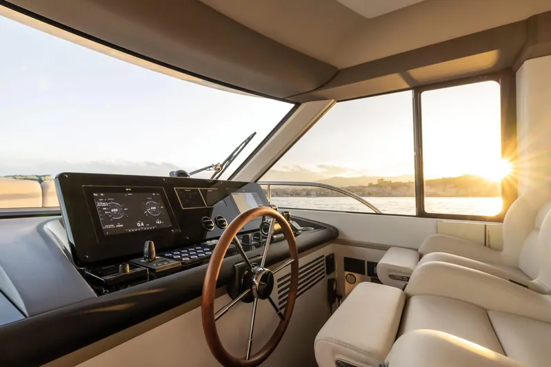  Yacht Photos Pics 2024 Azimut Magellano 60 yacht interior with modern helm and sunset view.