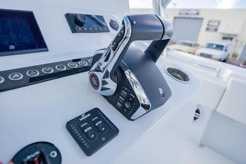  Yacht Photos Pics 2024 Contender 28 Tournament boat control panel with throttle and navigation instruments.
