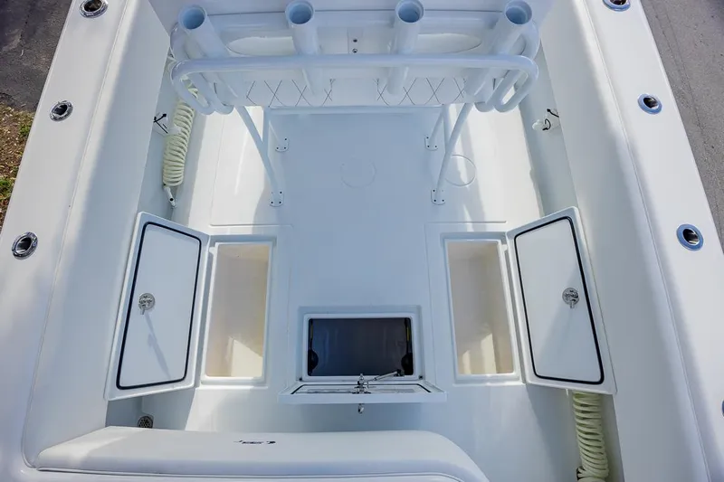  Yacht Photos Pics 2024 Contender 28 Tournament boat deck with storage compartments and rod holders.