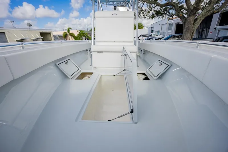  Yacht Photos Pics 2024 Contender 28 Tournament boat interior with open storage compartments.