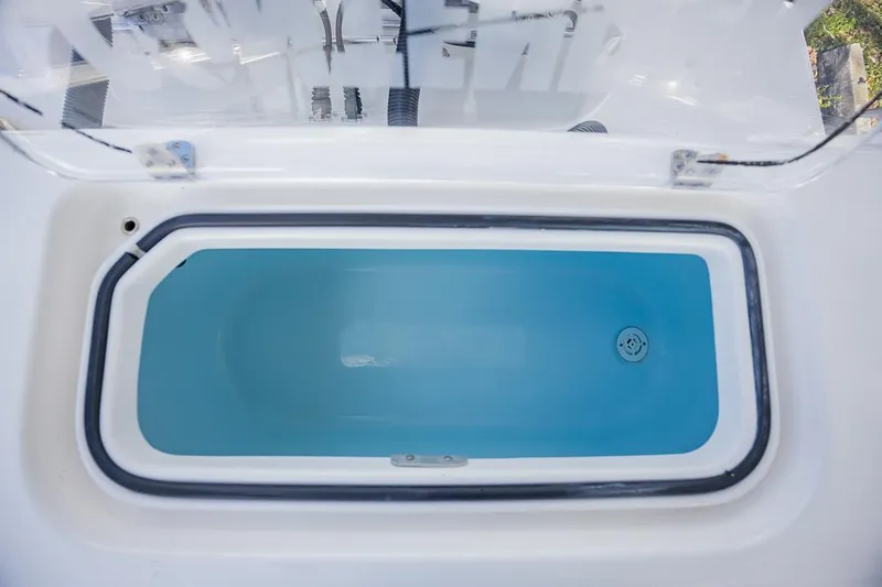  Yacht Photos Pics Livewell on 2024 Contender 28 Tournament boat, open lid, blue interior.