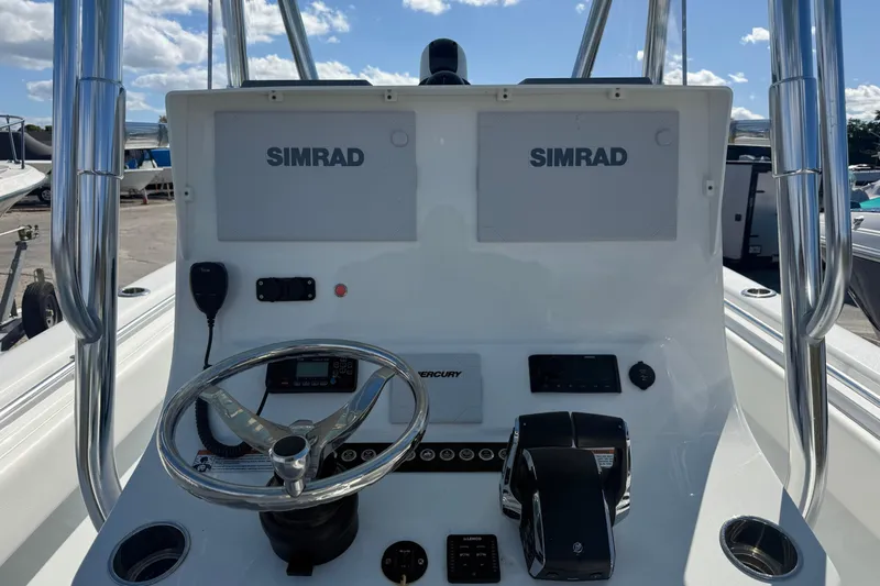  Yacht Photos Pics 2024 Contender 28 Tournament boat console with dual Simrad displays and Mercury controls.