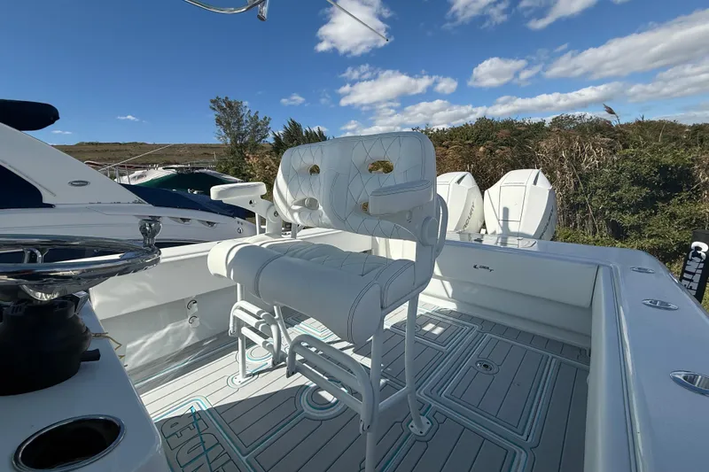  Yacht Photos Pics 2024 Contender 28 Tournament boat with white seating and dual outboard motors.