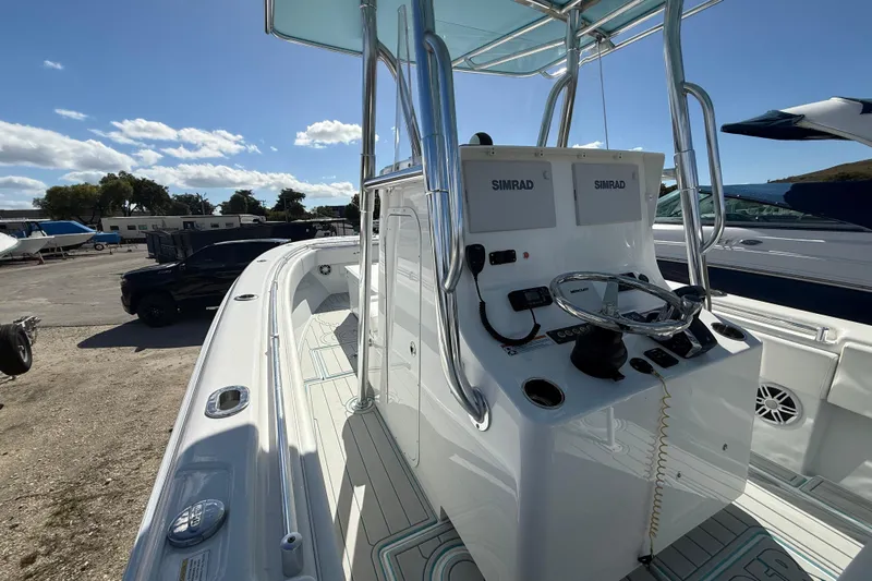  Yacht Photos Pics 2024 Contender 28 Tournament boat with dual Simrad displays and sleek design.