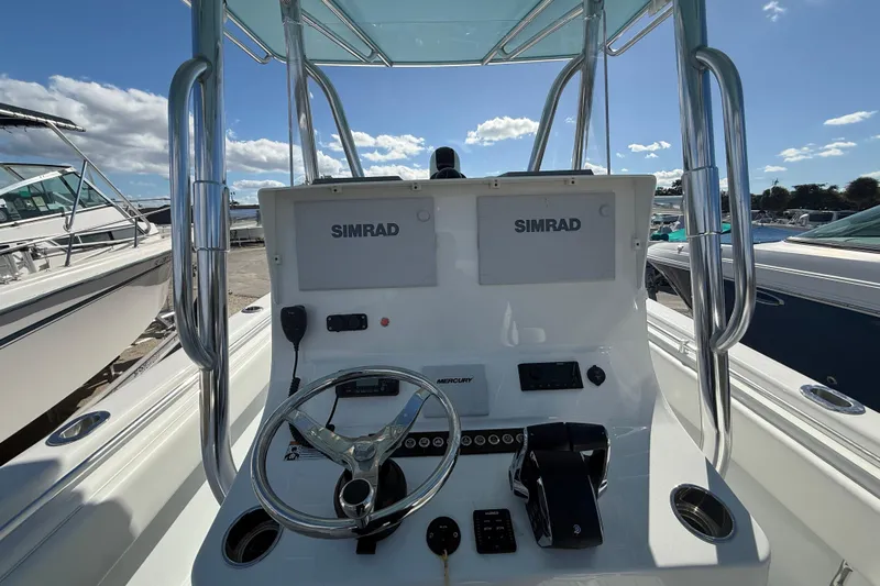  Yacht Photos Pics 2024 Contender 28 Tournament boat console with Simrad electronics and Mercury controls.