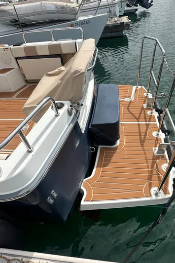 Cutwater 28 Yacht Photos Pics 2016 Cutwater 28 boat with teak deck and swim platform in marina.