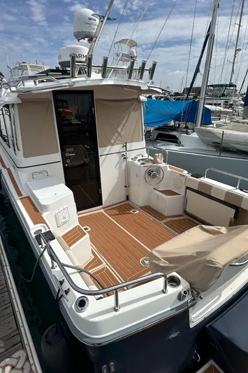 Cutwater 28 Yacht Photos Pics 2016 Cutwater 28 boat with spacious deck, docked at marina.