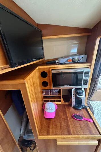 Cutwater 28 Yacht Photos Pics 2016 Cutwater 28 interior with TV, microwave, and coffee maker.