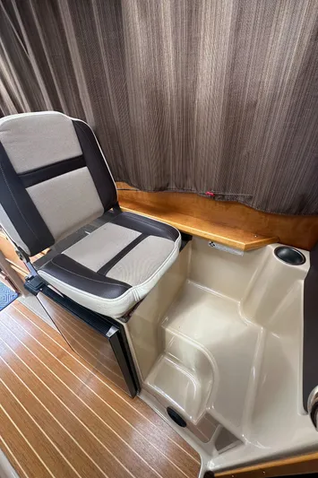 Cutwater 28 Yacht Photos Pics 2016 Cutwater 28 interior with seating and wood accents.