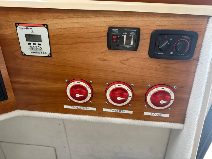 Cutwater 28 Yacht Photos Pics Control panel of a 2016 Cutwater 28 boat with labeled switches and meters.