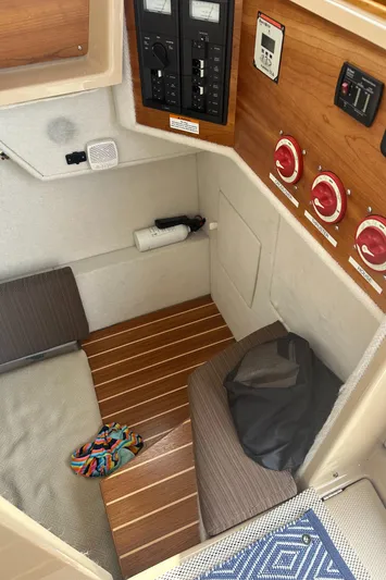 Cutwater 28 Yacht Photos Pics 2016 Cutwater 28 cabin interior with control panels and seating area.
