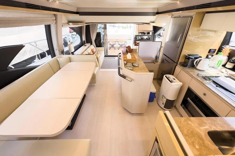  Yacht Photos Pics Luxurious interior of a 2017 Azimut 66 yacht with modern kitchen and seating area.