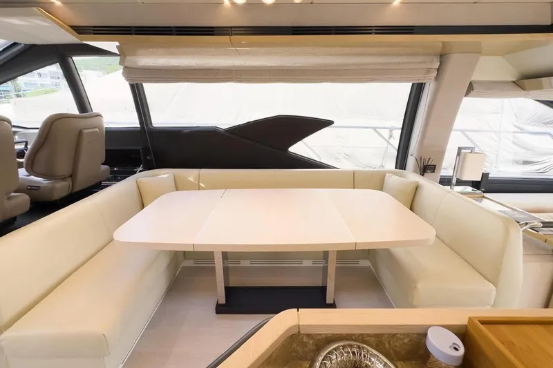  Yacht Photos Pics Luxurious interior of 2017 Azimut 66 yacht with elegant dining area and panoramic windows.