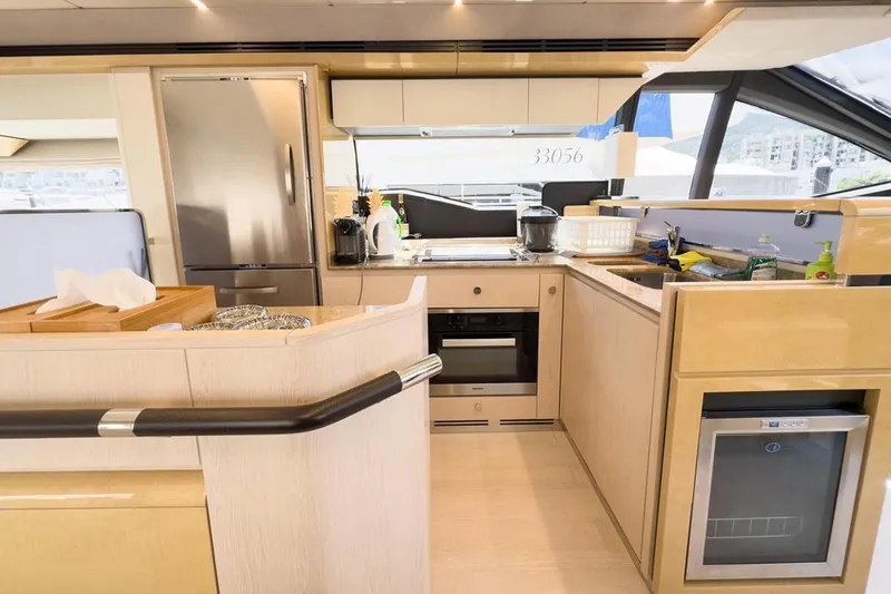  Yacht Photos Pics Luxurious kitchen interior of 2017 Azimut 66 yacht with modern appliances and sleek design.