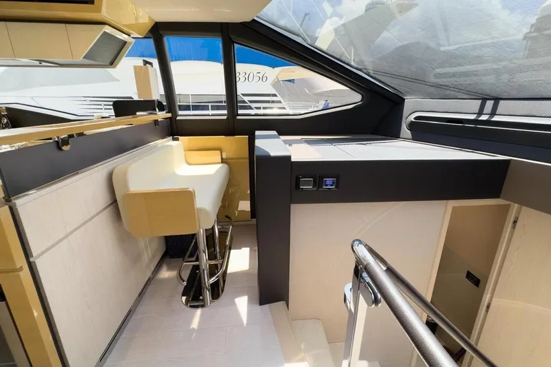  Yacht Photos Pics Luxurious interior of a 2017 Azimut 66 yacht with modern seating and sleek design.