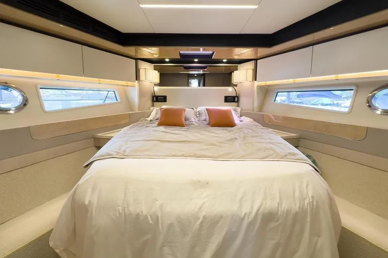  Yacht Photos Pics Luxurious bedroom interior of 2017 Azimut 66 yacht with modern design and cozy bedding.