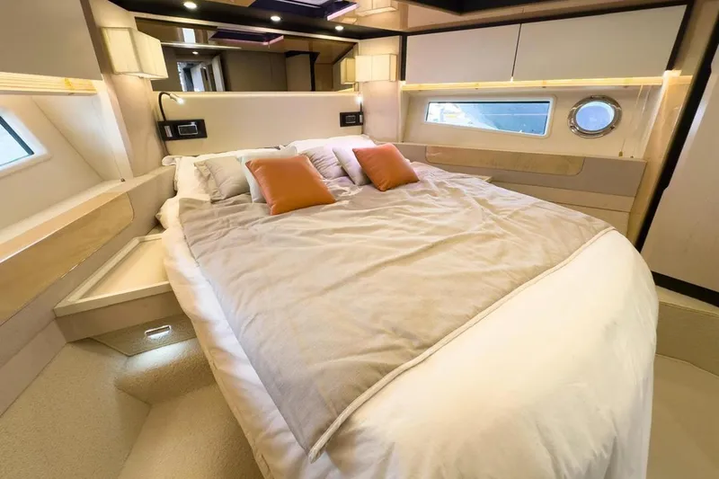  Yacht Photos Pics Luxurious bedroom interior of 2017 Azimut 66 yacht with modern design and cozy bedding.
