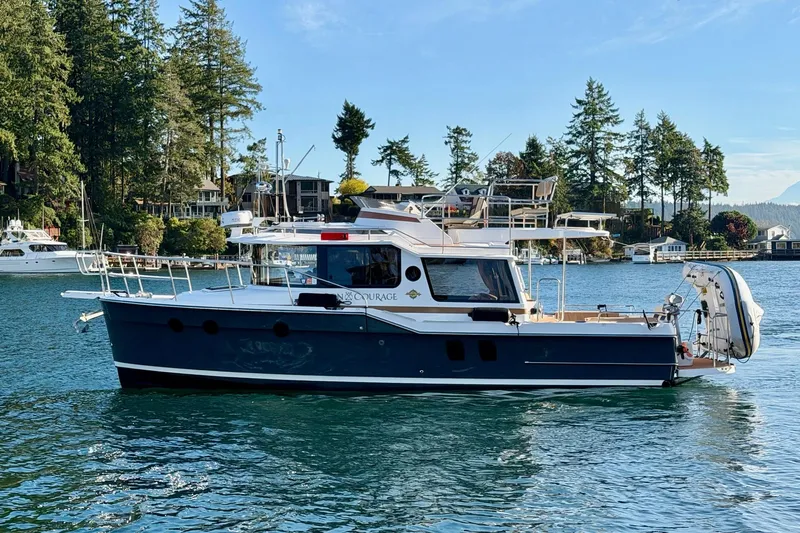 Bon Courage Yacht Photos Pics 2018 Ranger Tugs R-29 CB boat on scenic waterway with lush greenery.