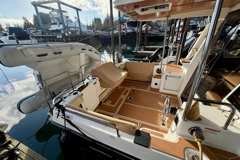 Bon Courage Yacht Photos Pics 2018 Ranger Tugs R-29 CB boat with spacious deck and docked inflatable dinghy.