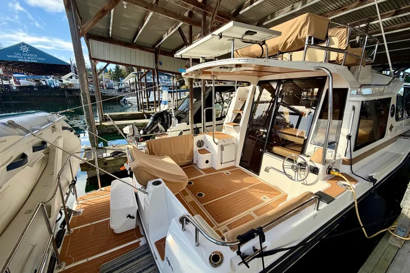 Bon Courage Yacht Photos Pics 2018 Ranger Tugs R-29 CB docked at marina, showcasing spacious deck and modern design.