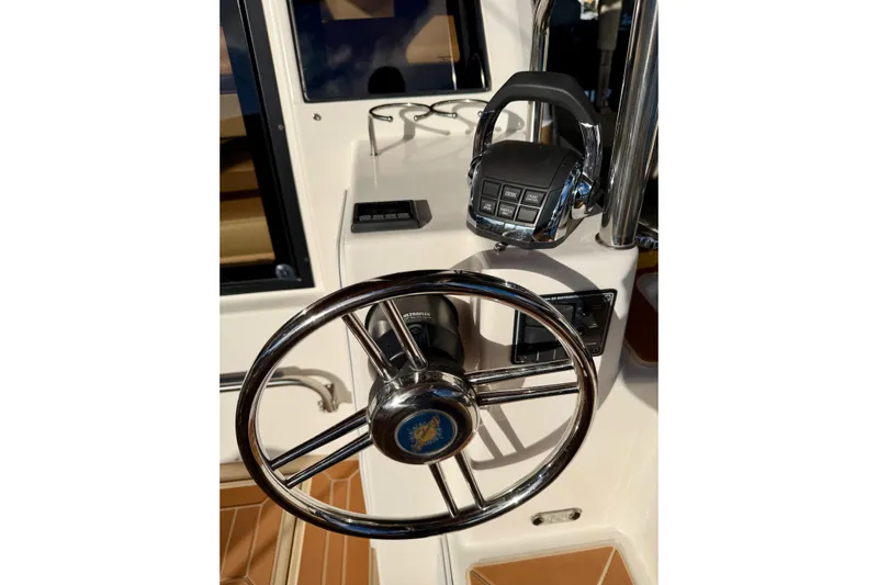 Bon Courage Yacht Photos Pics Steering wheel and controls of 2018 Ranger Tugs R-29 CB boat.