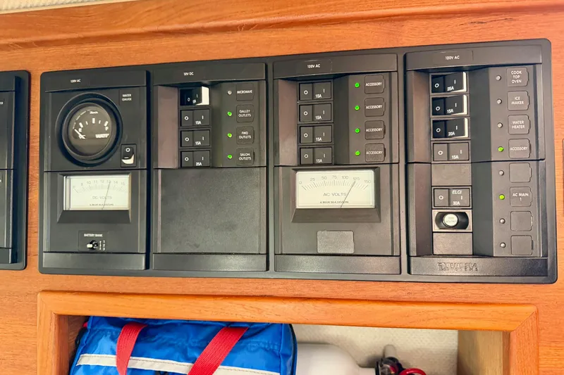 Bon Courage Yacht Photos Pics Electrical control panel of a 2018 Ranger Tugs R-29 CB boat, featuring various switches and gauges.