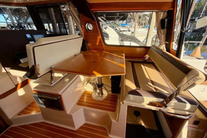 Bon Courage Yacht Photos Pics Interior of 2018 Ranger Tugs R-29 CB with wood accents and seating area.