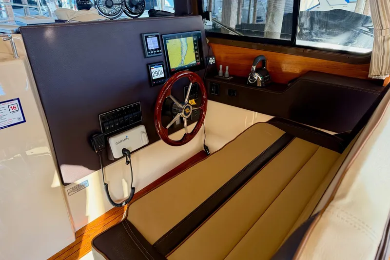 Bon Courage Yacht Photos Pics 2018 Ranger Tugs R-29 CB helm with navigation equipment and wooden steering wheel.