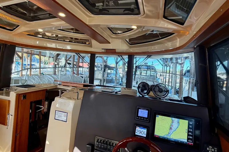 Bon Courage Yacht Photos Pics Interior view of 2018 Ranger Tugs R-29 CB boat with navigation equipment and panoramic windows.