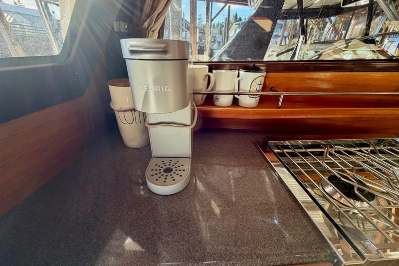 Bon Courage Yacht Photos Pics Keurig coffee maker in 2018 Ranger Tugs R-29 CB kitchen with mugs and stove.