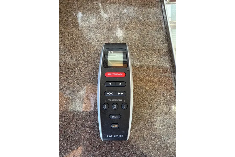 Bon Courage Yacht Photos Pics Garmin remote control on a Ranger Tugs R-29 CB, 2018 model, granite surface.
