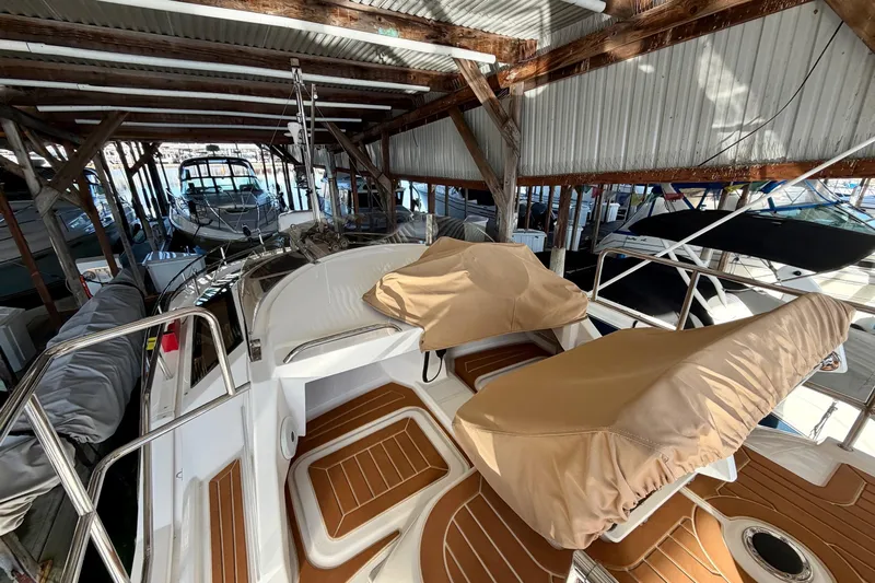 Bon Courage Yacht Photos Pics 2018 Ranger Tugs R-29 CB boat docked in a covered marina, featuring tan seat covers.