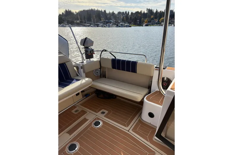 Bon Courage Yacht Photos Pics 2018 Ranger Tugs R-29 CB boat interior with seating and scenic water view.