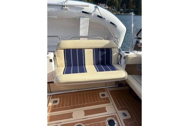Bon Courage Yacht Photos Pics 2018 Ranger Tugs R-29 CB boat with striped seating and teak-style flooring.