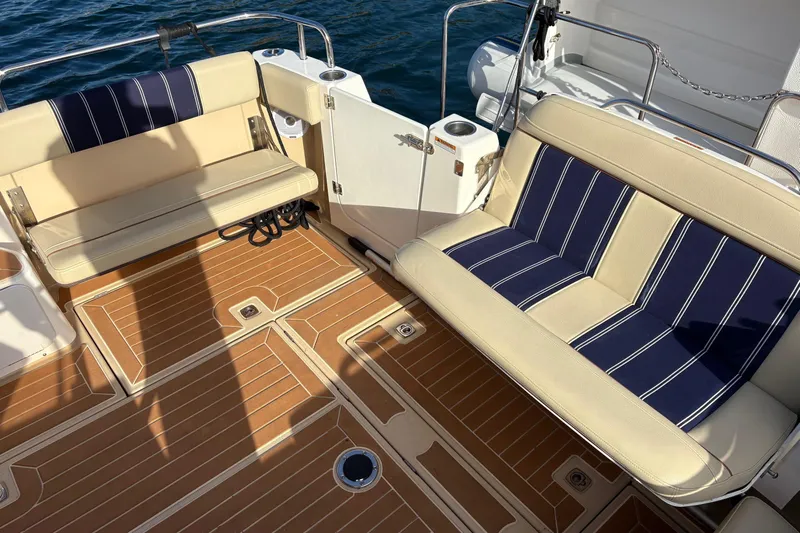 Bon Courage Yacht Photos Pics 2018 Ranger Tugs R-29 CB boat deck with cushioned seating and teak flooring.