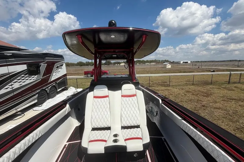  Yacht Photos Pics 2018 Statement 380 Open boat interior with luxurious seating and sleek design under a blue sky.