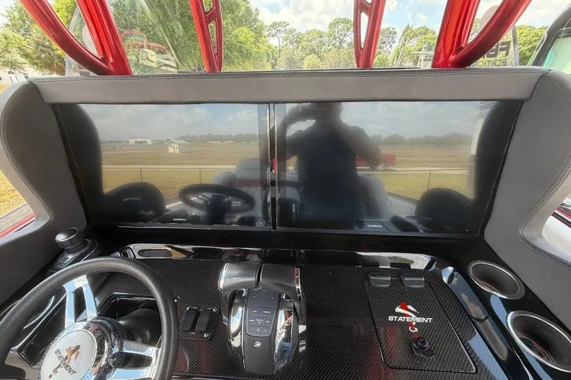  Yacht Photos Pics Cockpit of 2018 Statement 380 Open boat with dual Garmin displays and steering wheel.