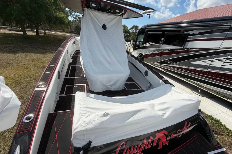  Yacht Photos Pics 2018 Statement 380 Open boat with custom covers, parked beside a luxury RV.