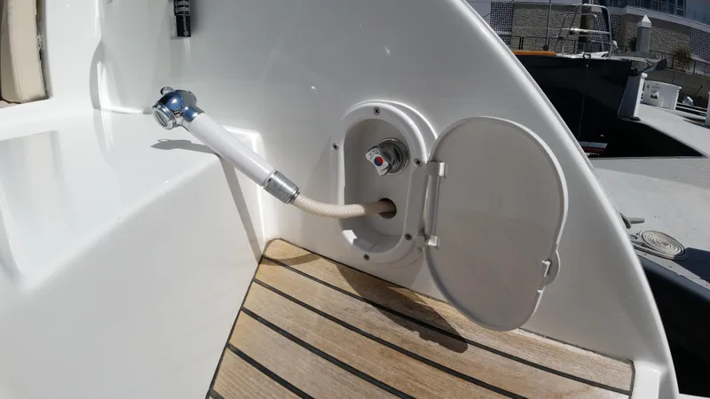  Yacht Photos Pics 2016 Beneteau GT35 boat deck with open hatch and hose connection.