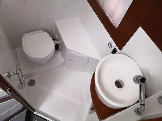  Yacht Photos Pics 2016 Beneteau GT35 bathroom with toilet, sink, and modern fixtures.
