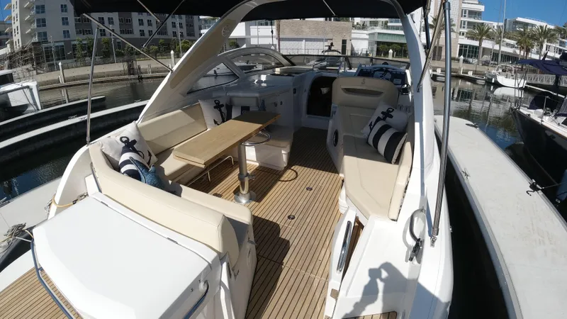  Yacht Photos Pics 2016 Beneteau GT35 yacht with spacious deck and seating area in marina.