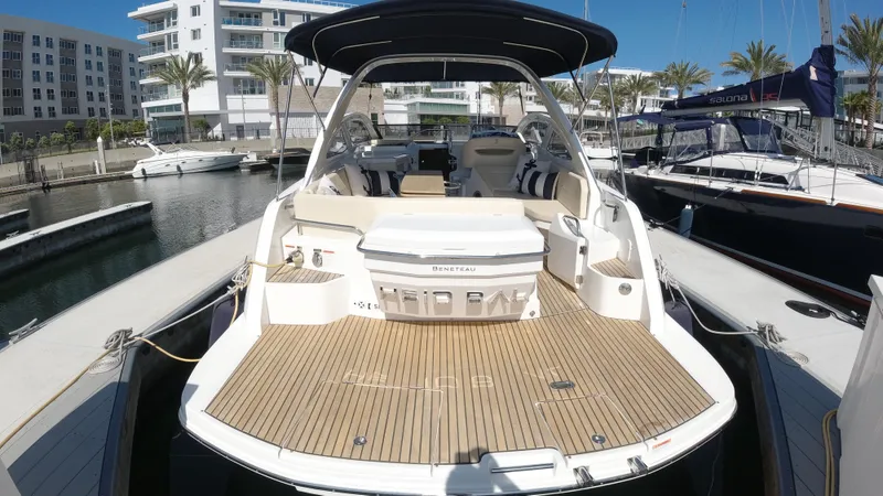  Yacht Photos Pics 2016 Beneteau GT35 yacht docked at a marina, showcasing its spacious deck and luxurious seating.