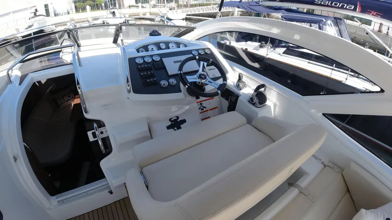  Yacht Photos Pics 2016 Beneteau GT35 cockpit with steering wheel and control panel.